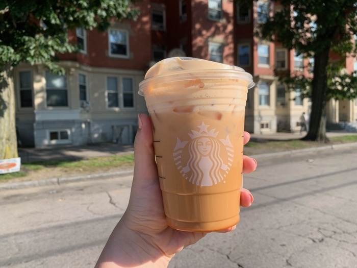 Starbucks Iced Pumpkin Chai Tea Latte Review - drink with logo