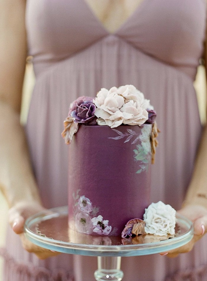 fall wedding cakes - plum frosting with frosted flowers