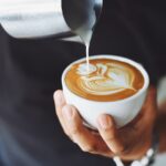 Coffee Jokes - person pouring latte