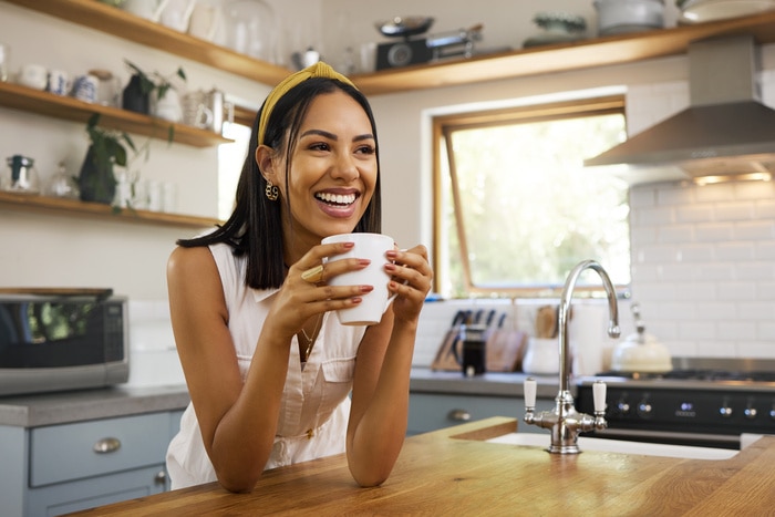 Coffee Jokes - woman drinking coffee at home