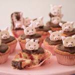 Kim Joy Recipes - Raspberry and Chocolate Cupcakes with Marshmallow Pig Topper