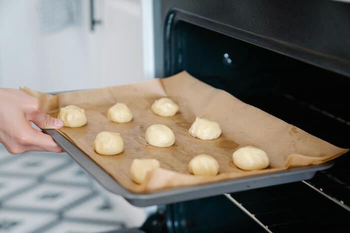 Baking Tips for Beginners - baker using parchment paper