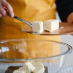 Baking Tips for Beginners - baker putting butter into bowl