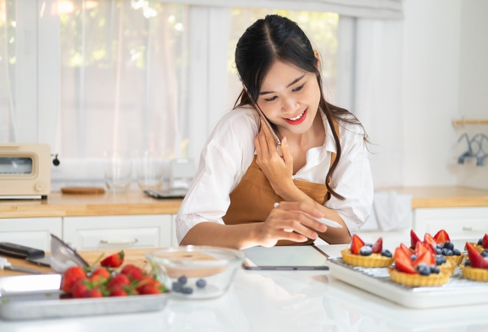 King Arthur Baking Pitchfest - Asian woman making fruit tart for online selling delivery